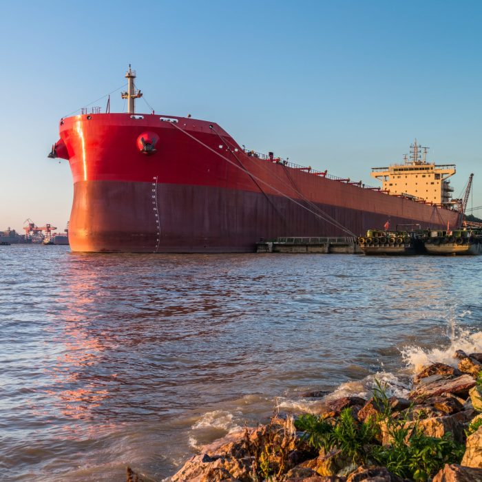 Cargo container ship at harbor in city of China.